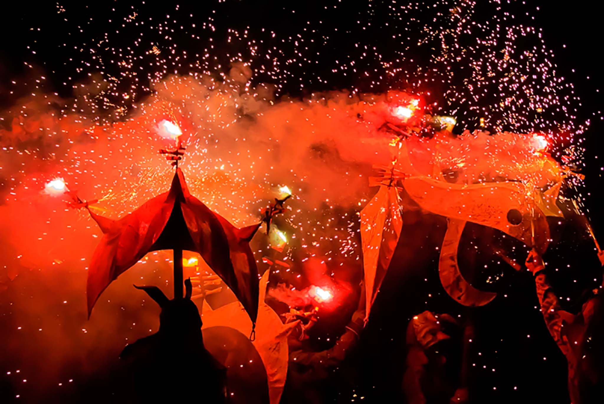 typical majorcan dance with demon costumes and fire