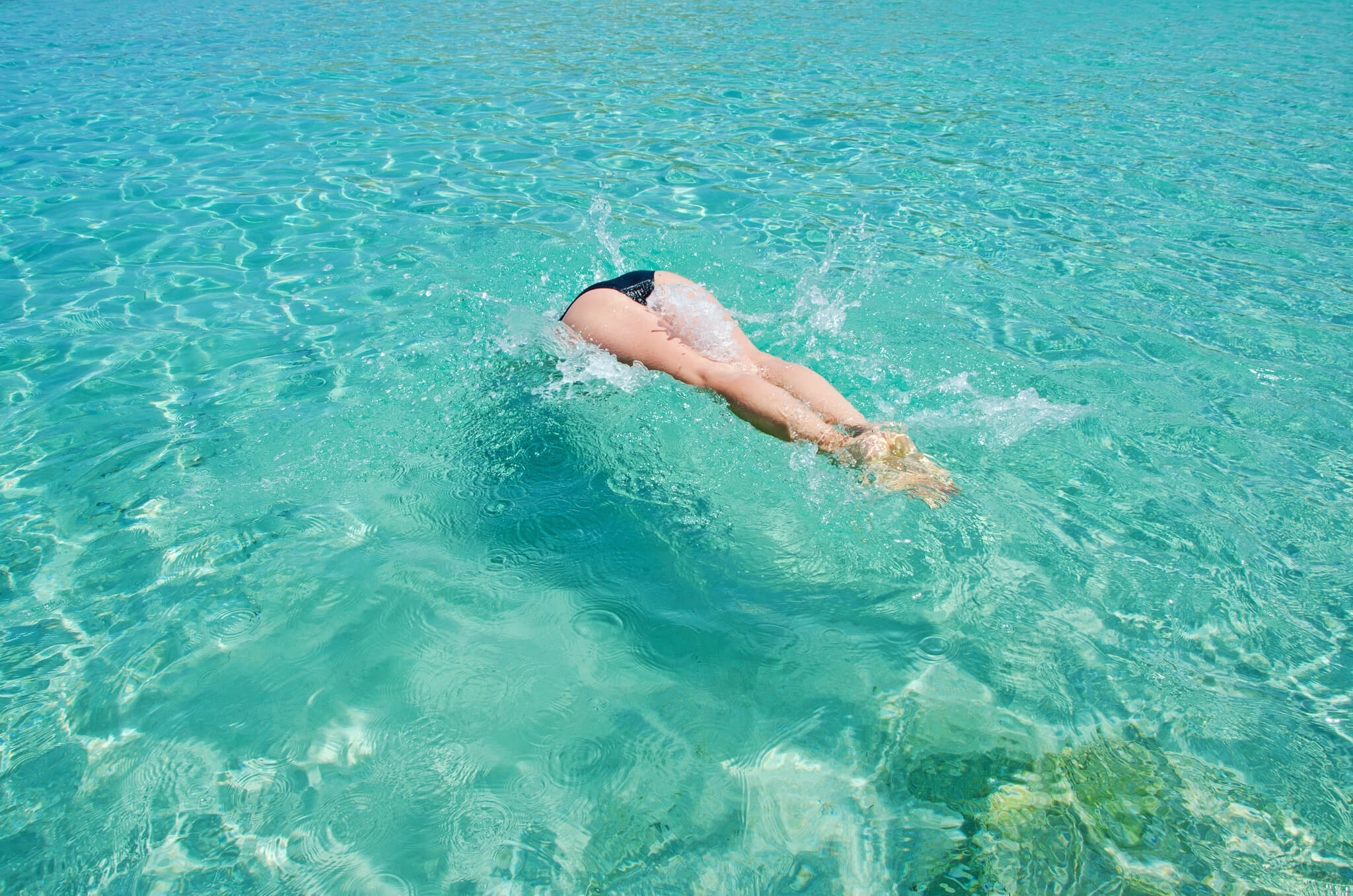 Woman swiming at the sea