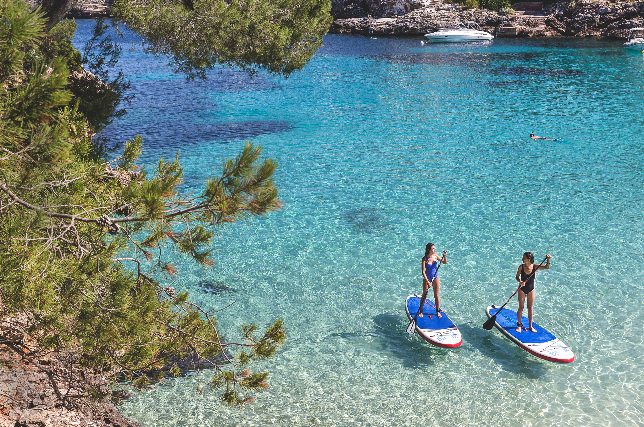 Women practinig paddle surf